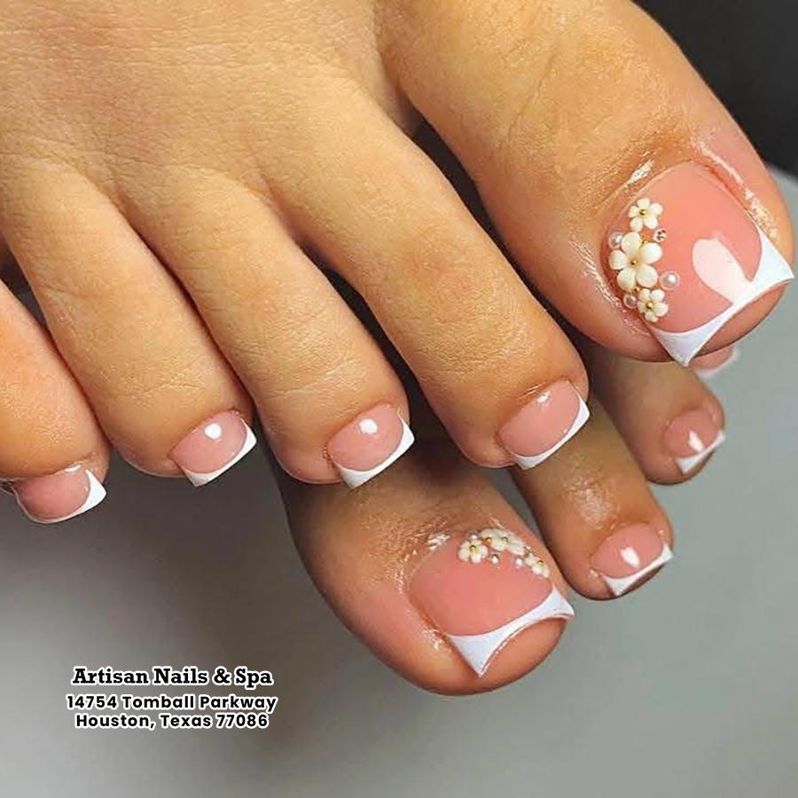 Flawless summer French pedicure with 3D white flowers Artisan Nails and Spa Houston