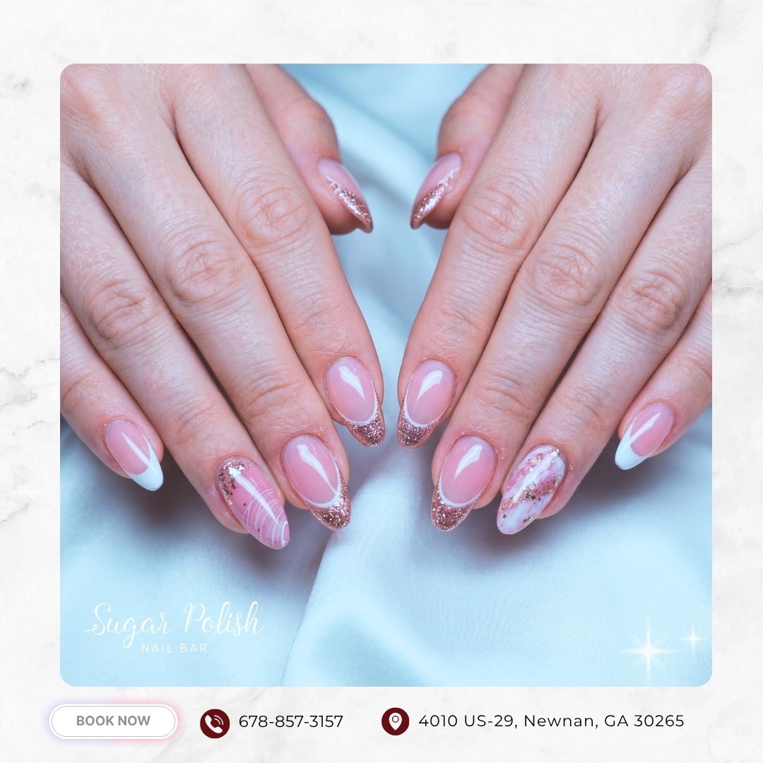 Soft pink almond nails with white tips and glitter accents at Sugar Polish Nail Bar in Newnan, GA