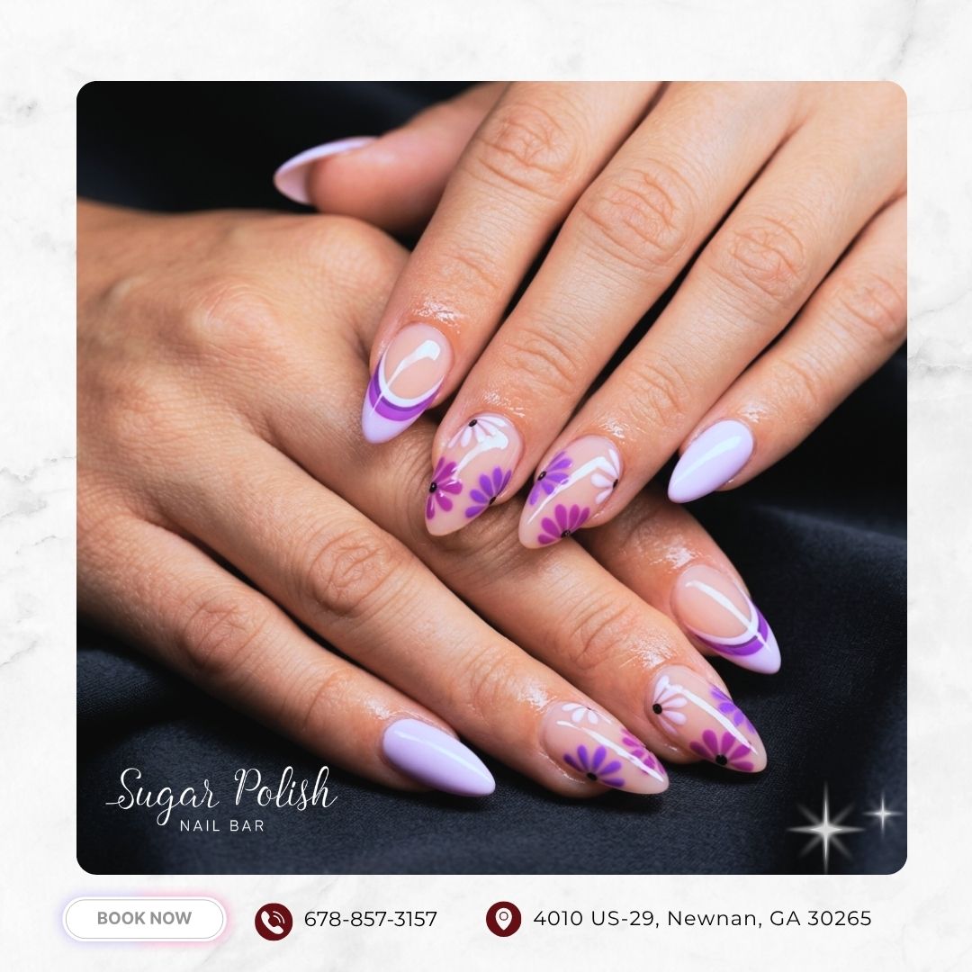 Almond-shaped pastel purple nails with abstract floral art and modern swirl details