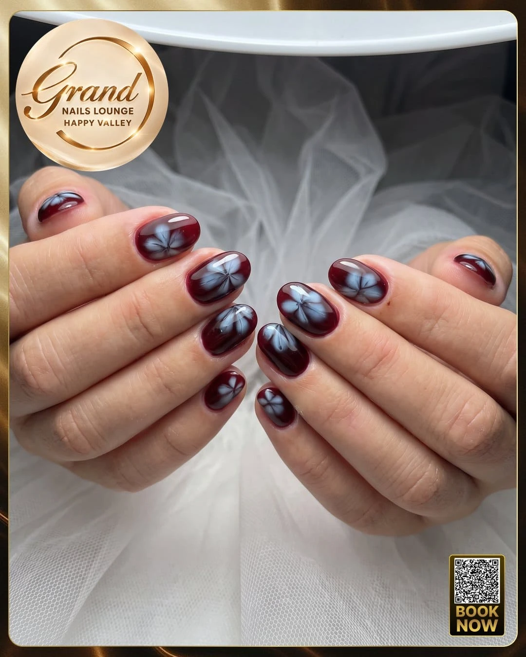 Glossy burgundy color powder dip manicure with blooming flower art at Grand Nails Lounge Glendale AZ