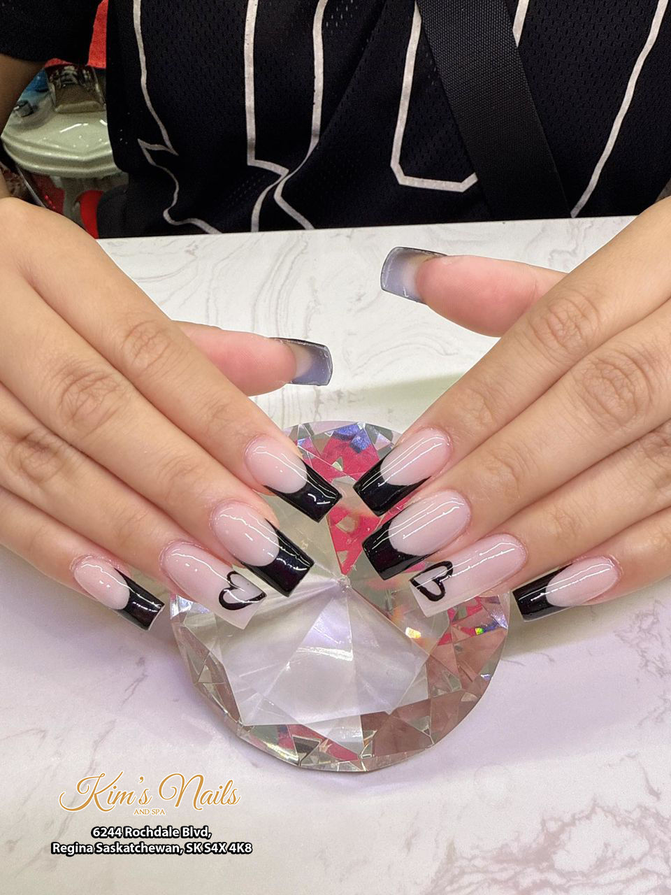 Most-Loved Nail Designs in Regina for Spring 2026: Client Favorites You Need to Try  When it comes to choosing the perfect nail design, nothing speaks louder than real client favorites. At Kim's Nails & Spa, we see trends come and go—but some styles consistently stand out because clients truly love them.  If you're in Regina and wondering what to get for your next appointment, this guide showcases the most requested, most loved nail designs for April and May 2026.  Why Client-Favorite Nail Designs Matter  Choosing a popular design isn’t about following trends blindly—it’s about:  Proven styles that look great on real hands Designs that last well over time Nail looks that suit everyday life and special occasions  These designs are not just trending—they’re trusted by real clients.  1. Soft Pink Ombre with Floral Accents (Elegant & Timeless)  This design is the definition of spring elegance. A soft pink ombre base paired with delicate white floral details creates a clean, feminine, and luxurious look.  Why clients love it:  Perfect for any occasion Soft and natural appearance Matches spring outfits effortlessly  Best for: weddings, brunch dates, everyday elegance  SEO keywords: pink ombre nails Regina, floral nail design spring  2. Rainbow Wave Nails (Bold & Playful)  For clients who want something fun and eye-catching, rainbow wave designs are a top choice. The flowing colors create movement and personality.  Why clients love it:  Bright, cheerful, and unique Great for vacations and events Expresses individuality  Best for: vacations, festivals, summer-ready looks  SEO keywords: colorful nail designs Regina, rainbow nails near me  3. Black French Tip with Heart Accents (Chic & Modern)  A twist on the classic French tip, this black-edge design with subtle heart details adds a bold yet classy vibe.  Why clients love it:  Minimal but stylish Works for both casual and formal settings Long-lasting and easy to maintain  Best for: date nights, work-friendly glam  SEO keywords: French tip nails Regina, modern nail designs  4. Pink Line Art Nails (Cute & Trendy)  Simple pink lines over a nude base create a clean and trendy look that’s perfect for spring.  Why clients love it:  Lightweight and natural feel Minimalist aesthetic Easy to match with any outfit  Best for: daily wear, subtle beauty lovers  5. Chrome Pastel Nails (Futuristic & Soft)  This shimmering pastel chrome finish is one of the hottest trends of 2026. It reflects light beautifully and gives nails a unique glow.  Why clients love it:  Eye-catching but not overwhelming Modern and trendy Works well on all nail lengths  Best for: fashion-forward clients  SEO keywords: chrome nails Regina, pastel nails 2026  How to Choose the Right Nail Design for You  Not sure which one to pick? Here’s how clients in Regina usually decide:  Consider Your Lifestyle Busy schedule → gel or simple designs Active lifestyle → shorter, durable nails Think About the Occasion Everyday → natural or minimalist Events → bold or artistic designs Match Your Personal Style Elegant → ombre, floral Trendy → chrome, line art Bold → colorful patterns Why These Nail Designs Are So Popular in Regina  At Kim's Nails & Spa, we’ve noticed that clients prioritize:  Comfort and wearability Clean, professional finishes Designs that look good in real life—not just photos  These styles check all the boxes, making them top choices for Spring 2026.  Nail Care Tips to Keep Your Design Looking Fresh  To maintain your nails after your appointment:  Moisturize your cuticles daily Avoid harsh chemicals Wear gloves when cleaning Schedule fills or maintenance every 2–3 weeks Book Your Favorite Nail Design Today  Spring is one of the busiest seasons for nail appointments in Regina. If you’ve found a design you love, don’t wait too long to book.  At Kim's Nails & Spa, we’re here to help you choose the perfect style that fits your personality, lifestyle, and occasion.  FAQs – Clients Also Ask  What nail design lasts the longest? Gel and acrylic designs tend to last the longest, especially with proper care.  Are these nail designs customizable? Yes, colors, shapes, and details can be adjusted to match your preferences.  Which design is best for everyday wear? Minimalist designs like ombre or line art are perfect for daily use.  How often should I change my nail design? Every 2–3 weeks is recommended to maintain a fresh look.  Do these styles work on short nails? Yes, most designs can be adapted for shorter nail lengths.  Final Thoughts: Real Designs, Real Confidence  The best nail design isn’t just about trends—it’s about how it makes you feel. These client-favorite styles are popular for a reason: they combine beauty, comfort, and confidence.  If you’re ready to upgrade your nails this spring, take inspiration from what real clients already love—and make it your own.